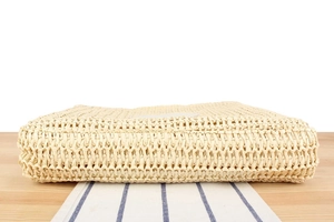 Detailed close-up showing the sturdy woven texture and rectangular base of this straw bag