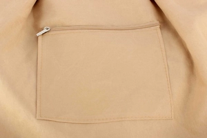 Detail view of khaki woven bag interior with functional metal zipper pocket