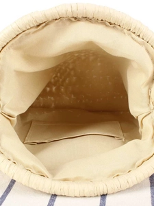 Interior view of beige woven tote bag showing the fabric lining and inner pocket detail