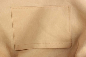 Macro shot of durable canvas interior pocket with reinforced double stitching on the bag