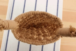 Top view of handwoven khaki cotton rope bag showcasing the rustic grid texture and interior