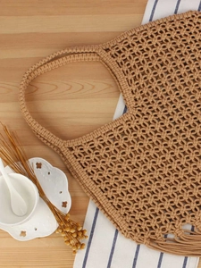 Handmade hollow mesh woven bag with long tassels for bohemian beach vacation style