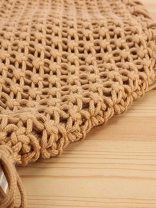 Handmade woven hollow mesh tassel tote bag for beach vacation in light khaki finish