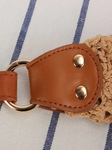 Fashionable woven bag with brown leather strap and gold ring detail for summer vacation