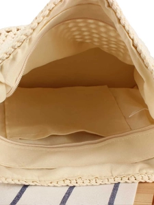 Chic woven beige tote bag featuring a spacious interior with zipper closure and lining