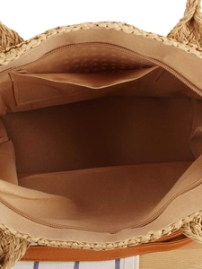 Top view of woven straw tote bag with a zipper interior and khaki fabric lining