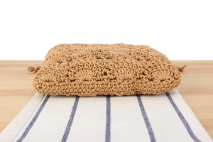 Detailed view of hand-woven cotton rope bag featuring intricate crochet floral patterns