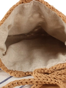 Handwoven straw shoulder bag with durable beige cotton lining and natural drawstring design