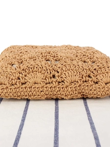 Handmade woven cotton rope clutch bag with textured crochet patterns for beach holidays
