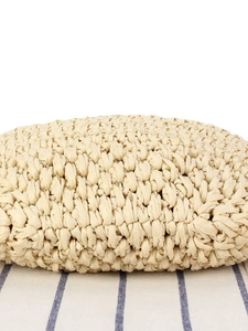 Minimalist beige woven straw tote handbag with handmade texture for beach vacations