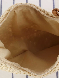 Straw woven tote bag with smooth inner lining and metal zipper closure for daily beach use
