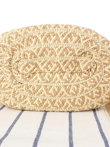 Bottom view of large handmade woven tote bag showing reinforced oval base texture