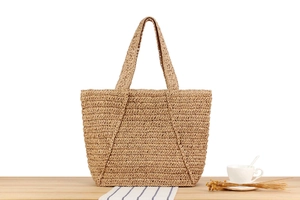 Detailed close-up of handmade woven tote bag showing natural texture and wide shoulder straps