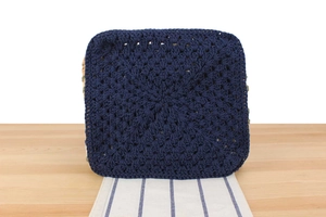Close-up of deep blue woven cotton crochet pattern showing detailed ethnic stitch texture