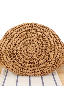 Handmade woven bag bottom detail with natural spiral paper rope fiber texture