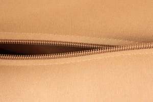 Detail of the high-quality durable canvas fabric and smooth matching zipper stitching