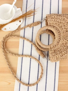 Handwoven straw shoulder bag with detachable strap and top handle for beach vacation