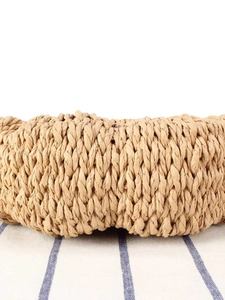 Handcrafted woven straw bag in light khaki, perfect for casual summer beach vacations