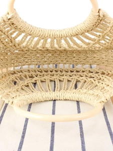 Handcrafted woven straw tote bag with round resin handles and hollow knit design