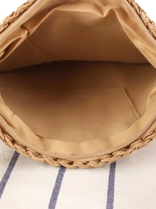 Minimalist straw woven bag with natural khaki texture and soft fabric lining detail