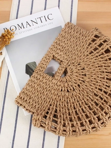 Handmade woven straw handbag with a unique semi-circle design and hollow mesh patterns
