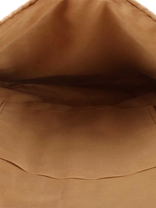 Brown straw woven bag interior with functional slip pocket and smooth fabric lining