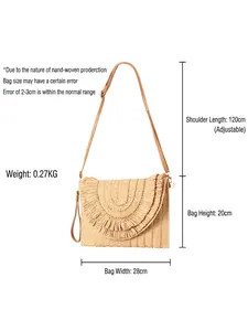 Handmade woven straw crossbody bag with tassel fringe detail and adjustable shoulder strap