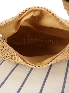 Top view of a woven beach bag with secure zipper closure and spacious interior lining