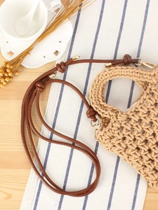 Handmade woven cotton rope crossbody bag with hollow crochet design for summer fashion