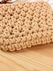 Handmade woven cotton rope crossbody bag with hollow crochet design for summer