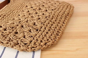 Detailed macro shot of the handmade hollow straw weave texture and wood color material