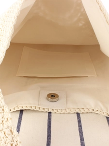Handmade crochet shoulder bag with cotton lining and magnetic closure interior view