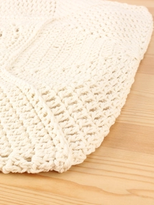 Chic cream cotton woven shoulder bag with intricate crochet pattern for beach vacations