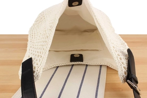 Detailed view of handmade woven bag with canvas lining and secure magnetic closure