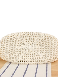 Handmade white woven crochet tote bag with intricate hollow texture for summer beach vacation