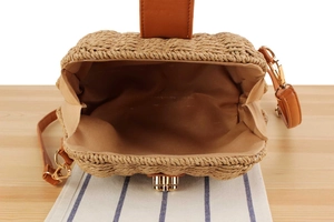 Top view of handmade woven crossbody bag showing large capacity and brown leather handles
