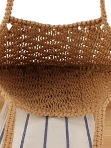 Spacious interior of handmade bohemian cotton rope woven tote bag for seaside holidays