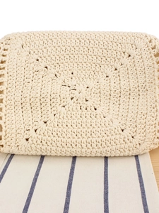 Handcrafted cream crochet woven handbag with intricate floral cutout patterns and textures
