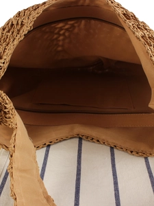 Handwoven brown straw shoulder bag featuring a zippered inner pocket and fabric lining