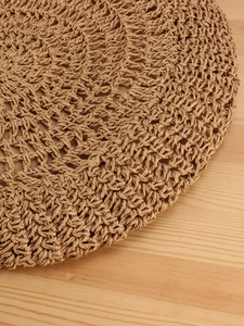 Handmade woven straw shoulder bag with natural brown hollow texture for beach vacation