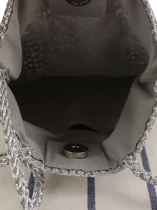 Handmade crochet bag with silver woven texture, fabric lining and magnetic closure