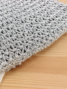 Handcrafted silver crochet handbag with metallic finish for beach holidays and casual use