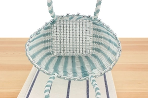 Top-down view of blue and white striped handwoven plastic tote bag with spacious interior