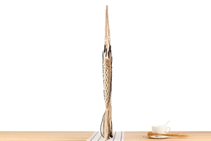 Detail of handmade macrame hanging basket with woven patterns and long fringe tassels