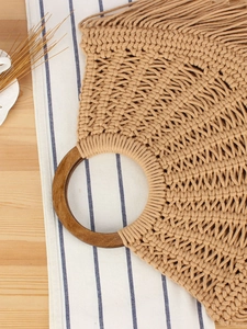 Handmade woven cotton rope tote bag with round wooden handles and bohemian side fringes