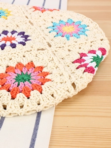 Handmade colorful crochet knit bag with floral patterns for bohemian vacation style