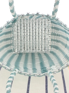 Handmade woven plastic tote bag in blue and white grid pattern for beach vacations