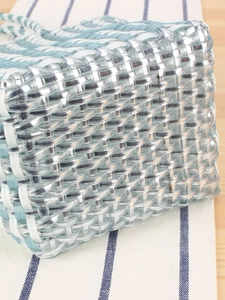 Handmade woven plastic tote bag in light blue and white grid for summer beach vacations
