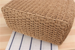 Close-up of natural paper rope woven handbag showing detailed cross-weave texture