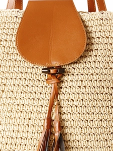 Minimalist straw woven shoulder bag with brown leather flap and stylish tassel detail